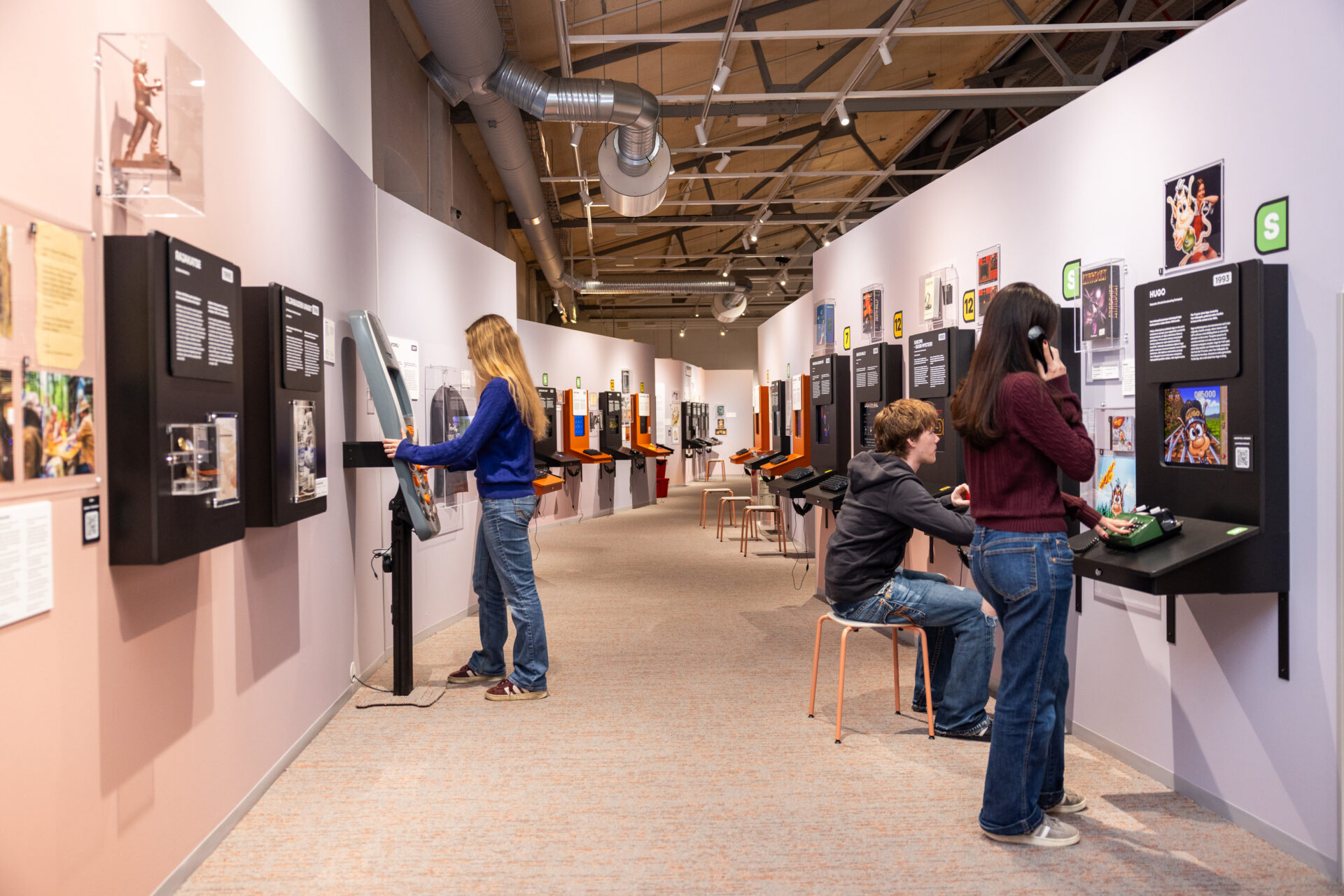 People playing games in the Finnish museum of Games.
